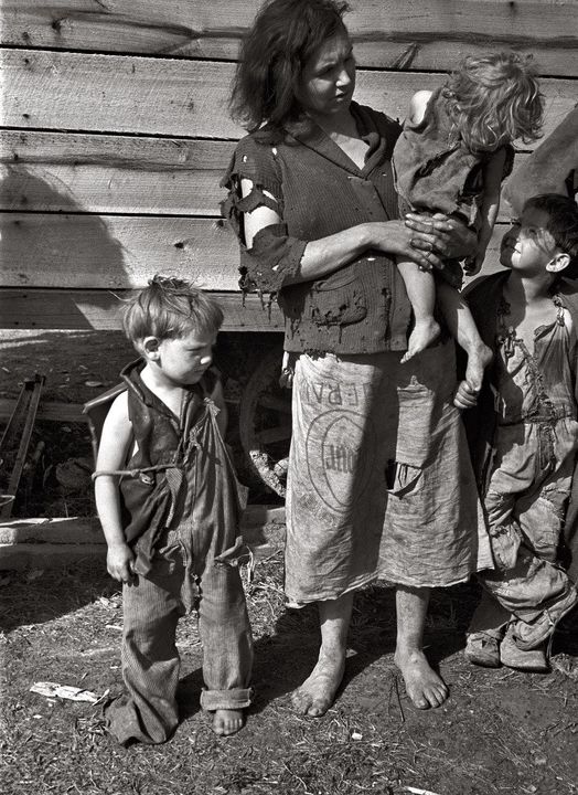 MOTHER AND CHILDREN DURING THE GREAT DEPRESSION, Tennessee River.  Circa 1936.   "Mother and baby of family of nine livi